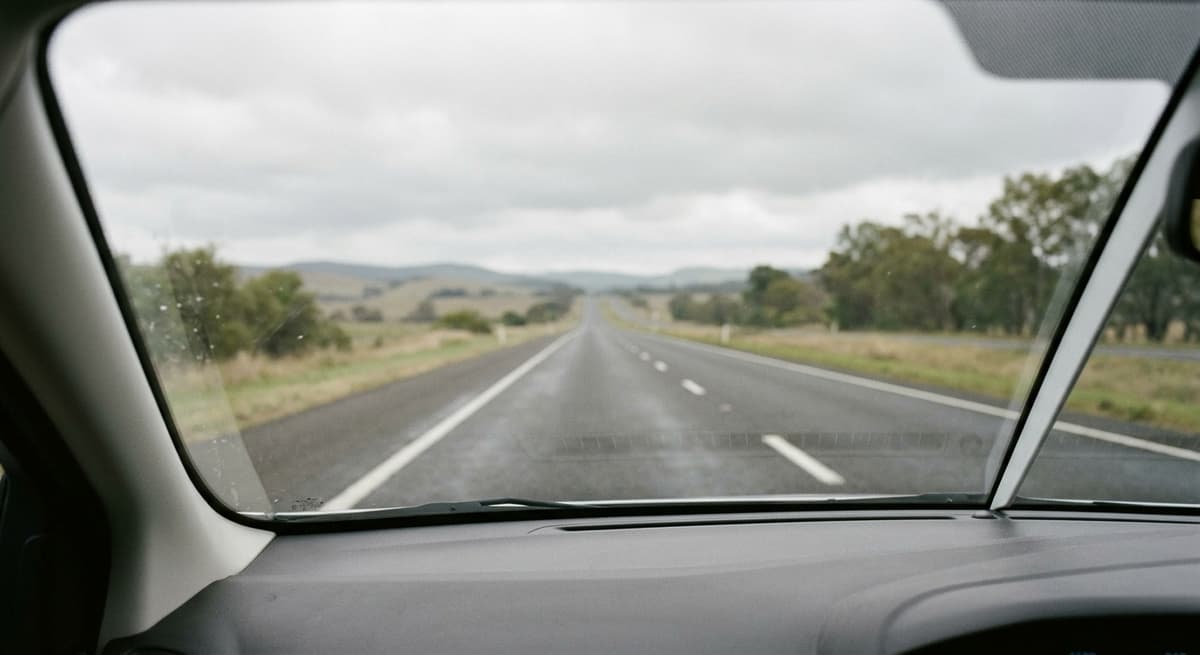 Virginia highway road stretching ahead with lane markings, captured through a clean winds