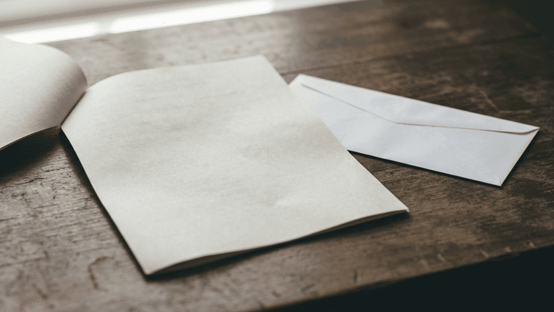 FOIA request form document on a desk beside an envelope